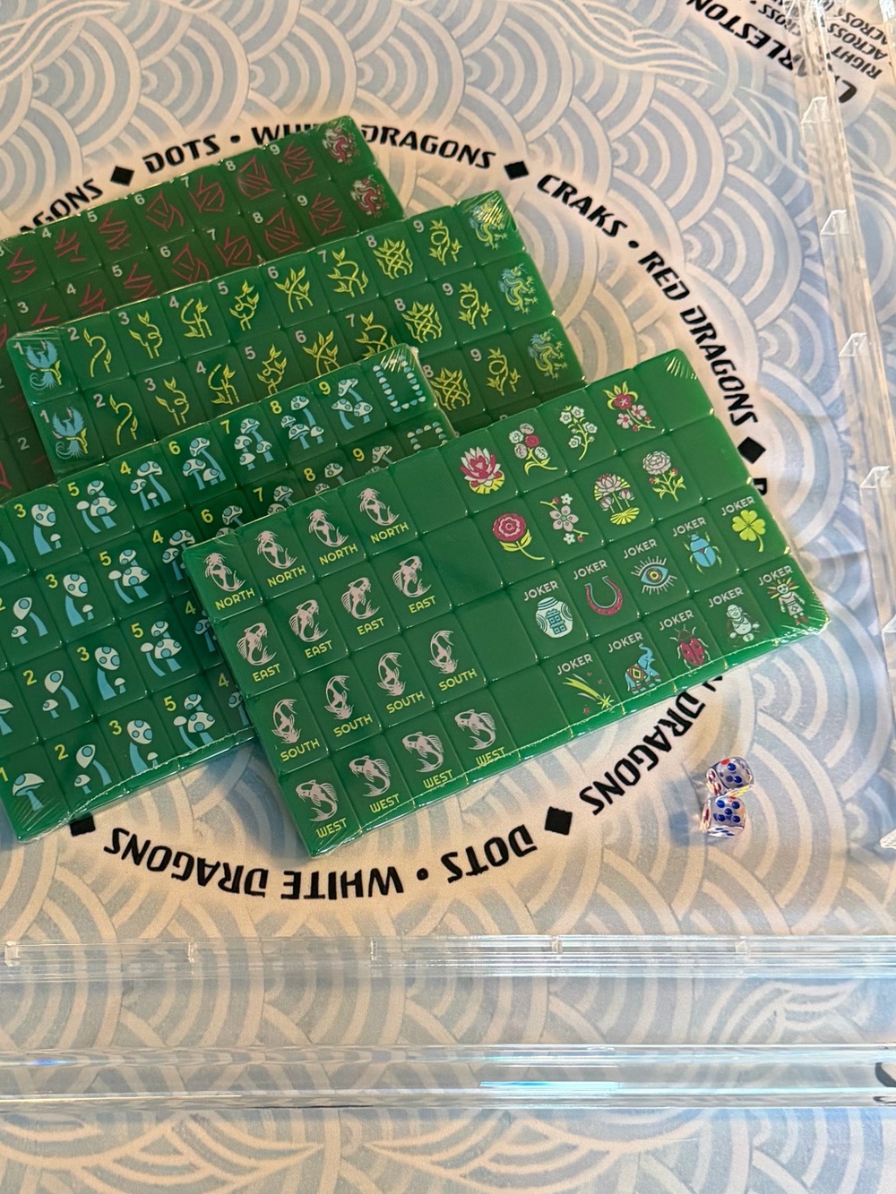 Mahjong set with tiles, mat and racks